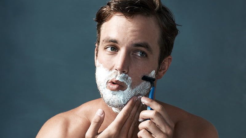 Man shaving his beard 