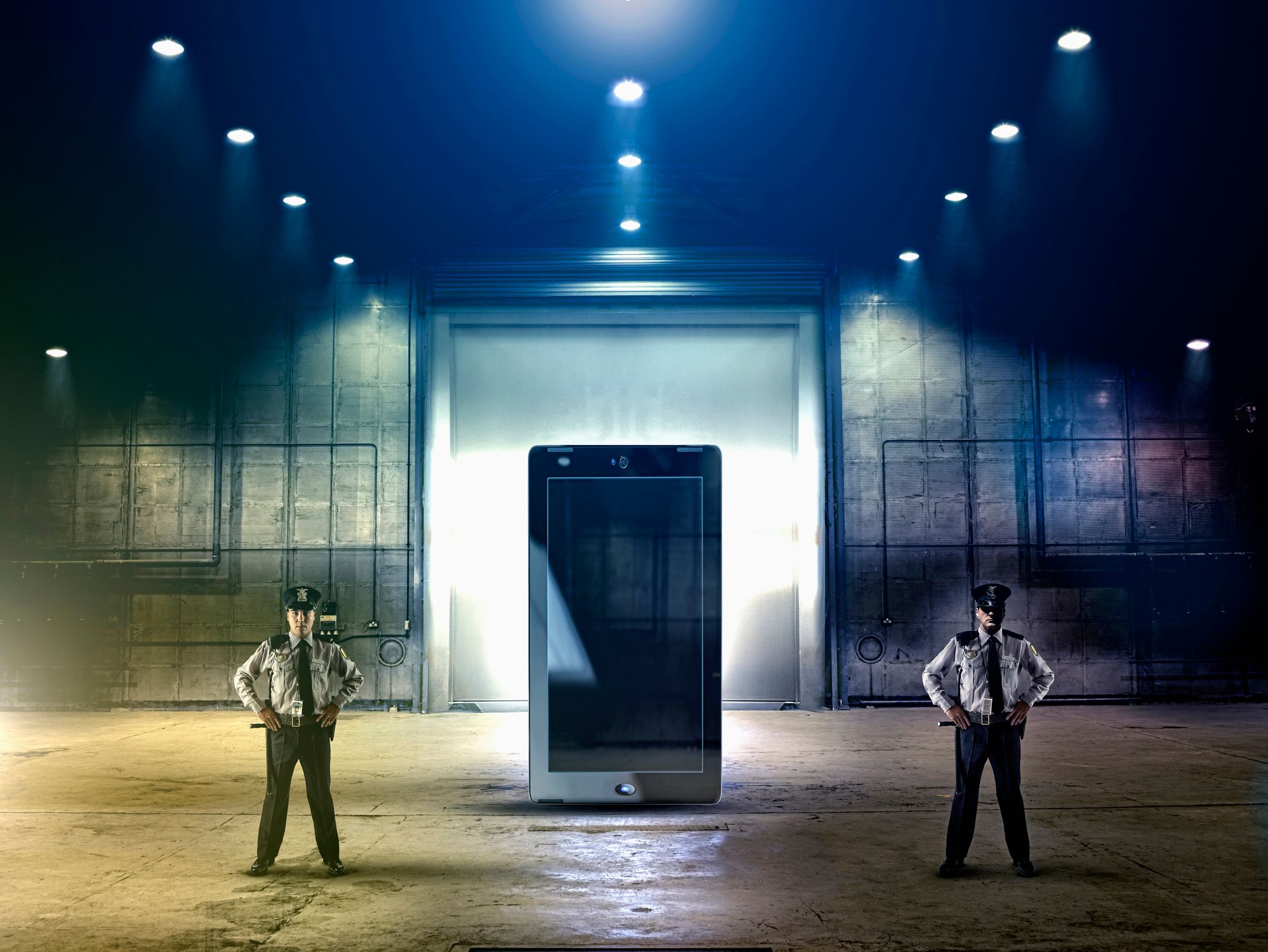 two guards guarding a giant cell phone