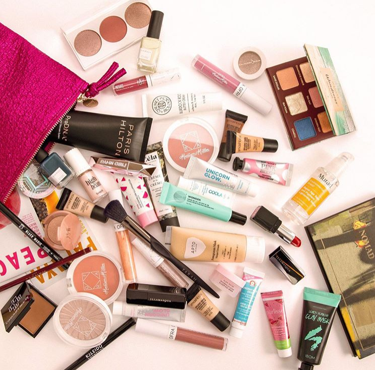 An array of makeup samples from a pink Ipsy bag
